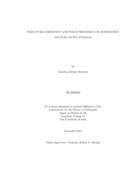 Structure formation and wave phenomena in moderately coupled dusty plasmas
